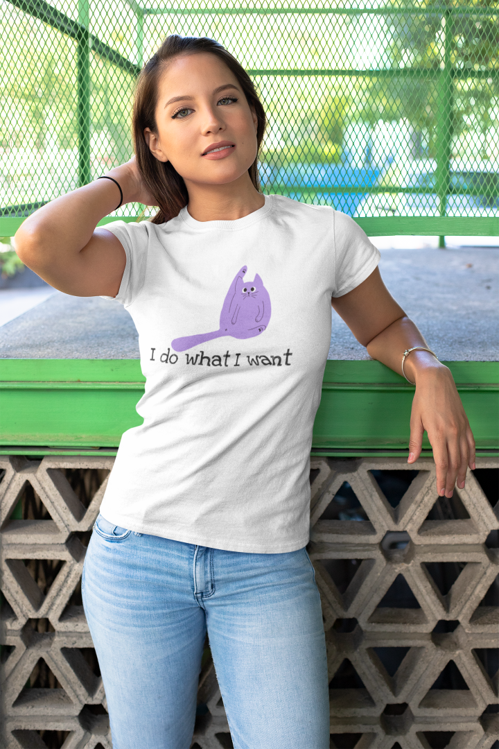 model in a white shirt that has a picture of a cat licking its arse and the words i do what I want